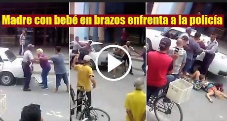 Madre con bebé en brazos enfrenta a la policía